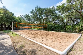 A volleyball court at the whispering winds apartments in pearland, tx